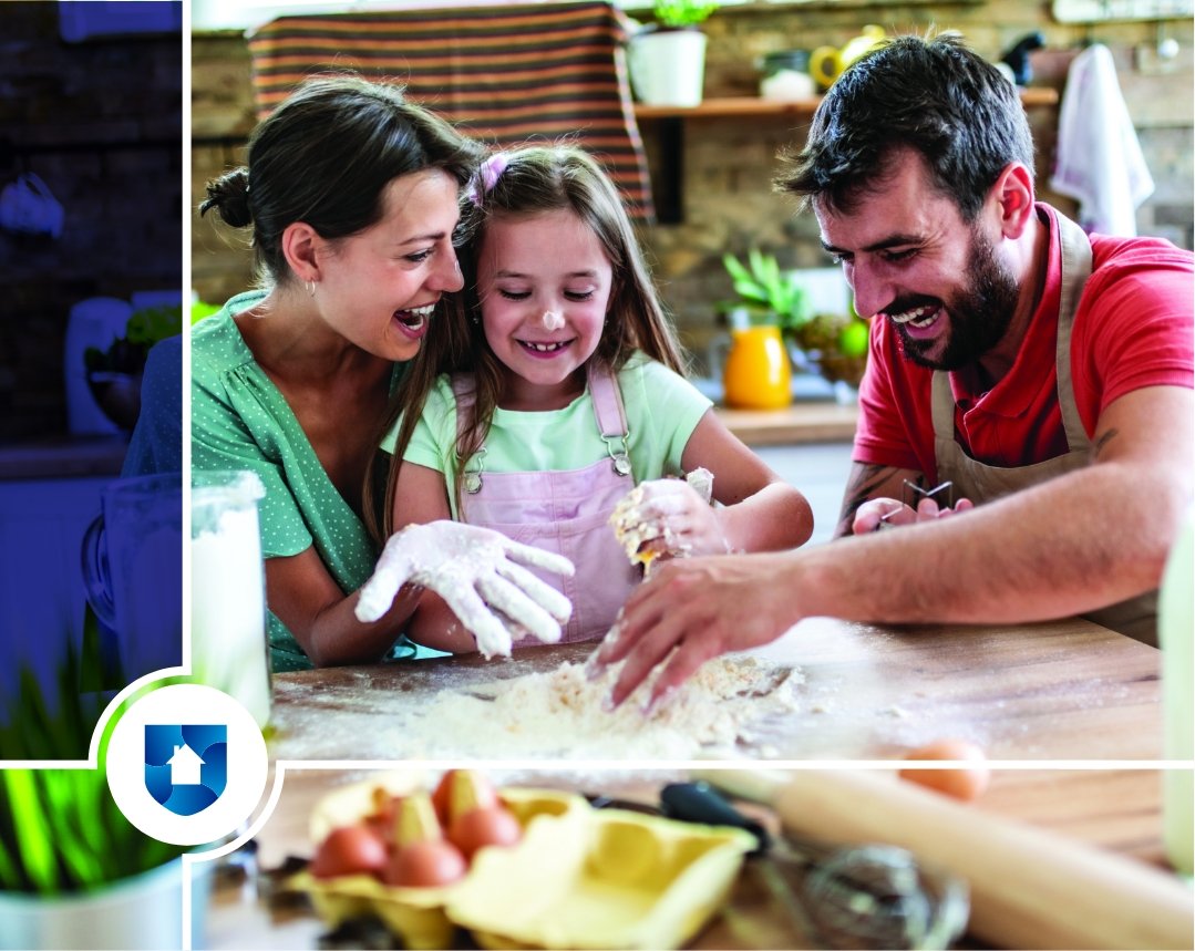 Mom, dad, and young daughter baking in the kitchen while laughing