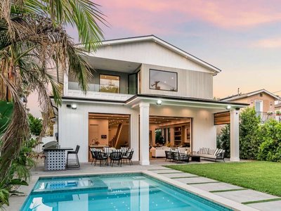 Beautiful home with pool at sunset